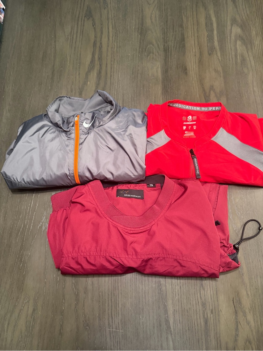 3 windbreakers: Nike, Greg Norman Demarini